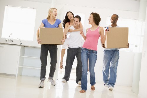 Movers handling a residential move in Balham with boxes and furniture