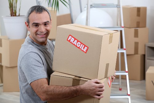Packed moving boxes and furniture ready for a Balham house move