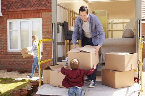 Moving home in Balham with packed boxes and removal van