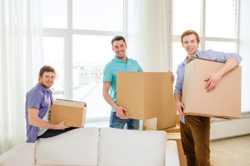 Removal staff planning a careful move near a property entrance