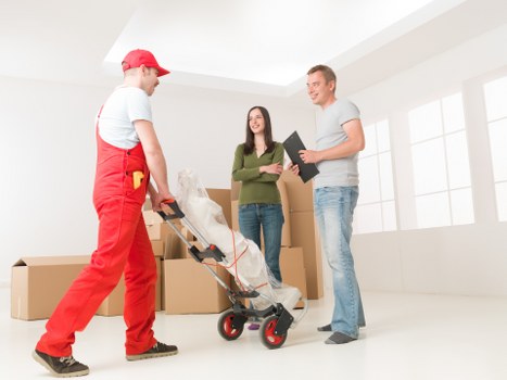 Packed office boxes and furniture ready for relocation