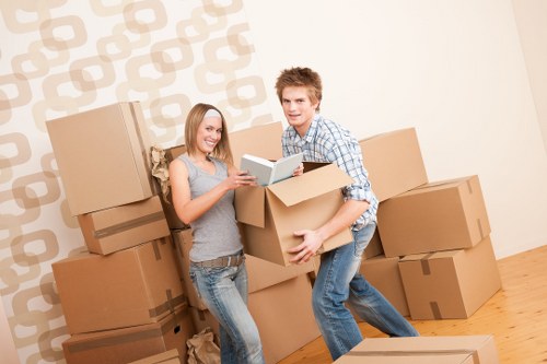 Local movers handling desks and storage items during a Balham office move
