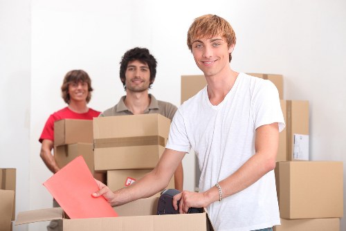 Packed moving boxes ready for transport in a Balham property