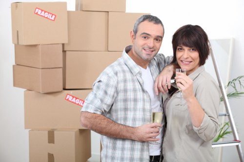 Professional movers handling packed boxes during a Balham relocation